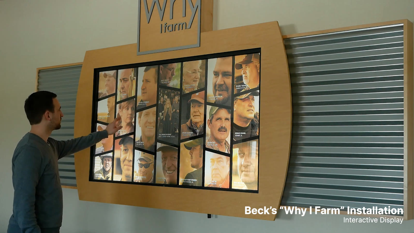 A visitor selecting a portrait on the Why I Farm story wall